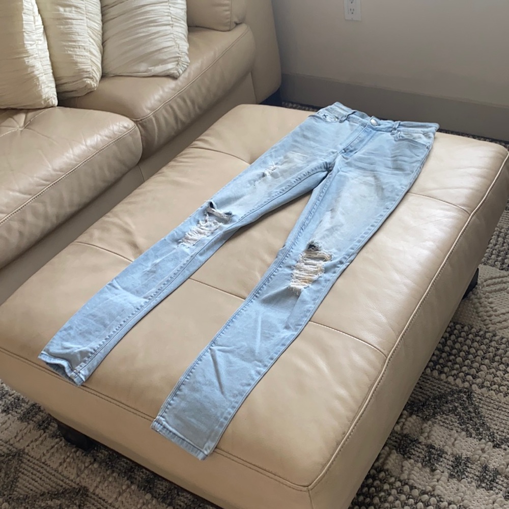High rise light wash skinny ripped jeans